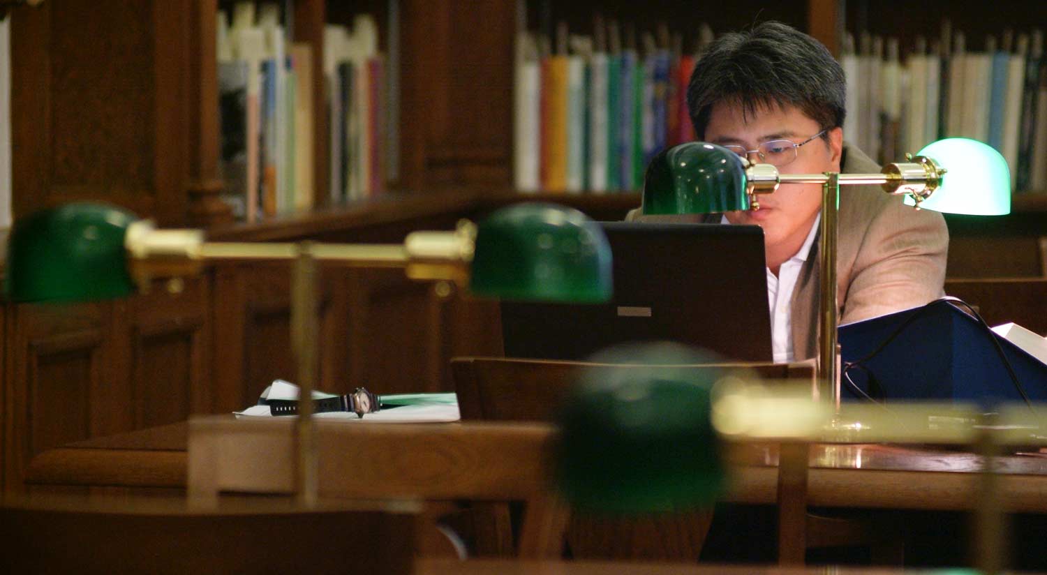 A student on their laptop in Cushing Library